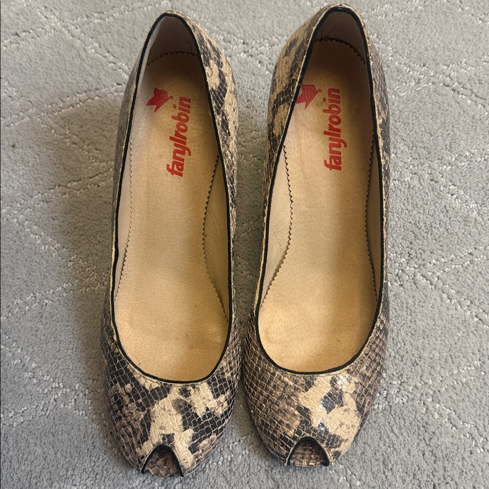 Tan and black snakeskin style heels. Gently worn. Very comfortable heel